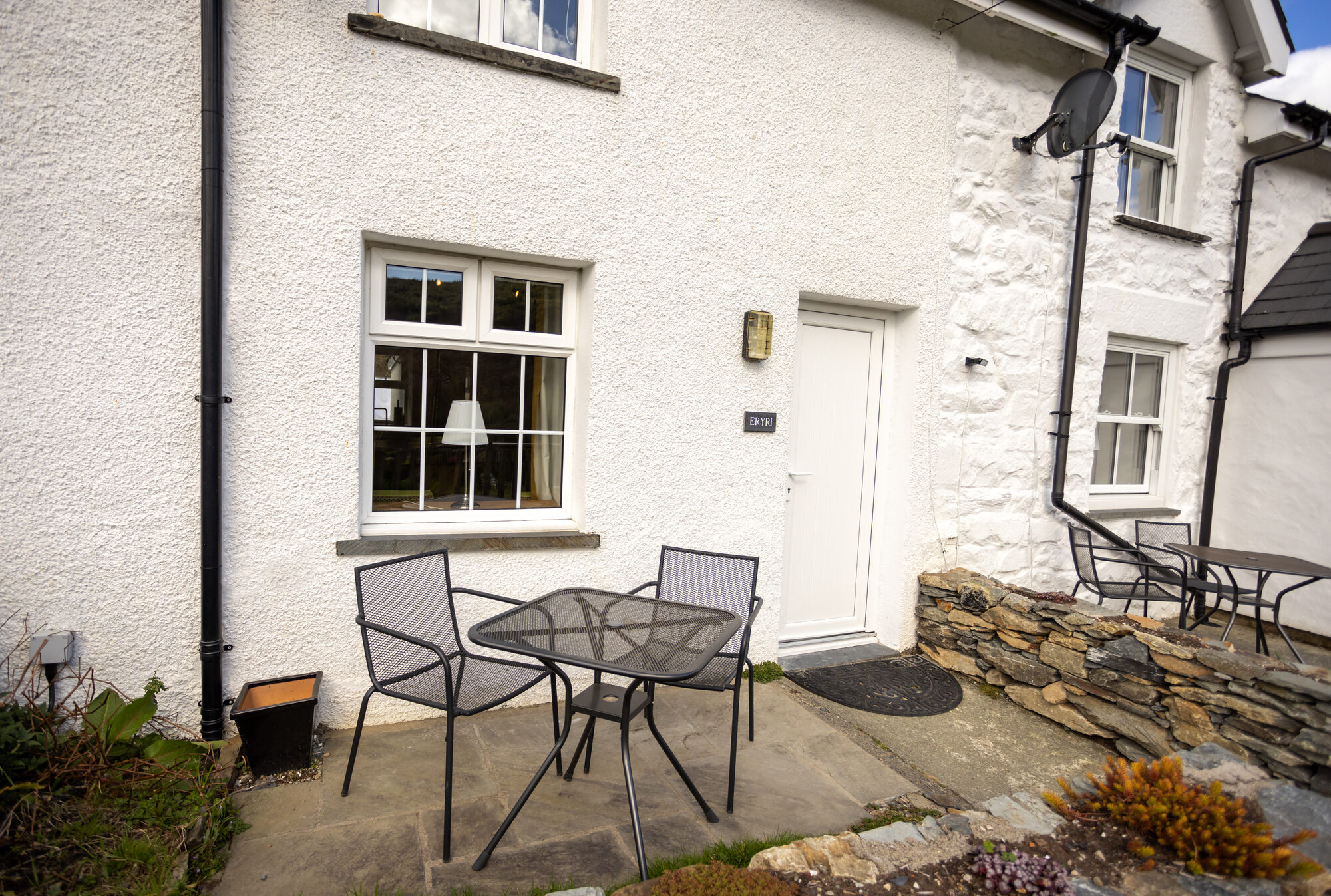 Bistro table outside Eryri Cottage in Capel Curig