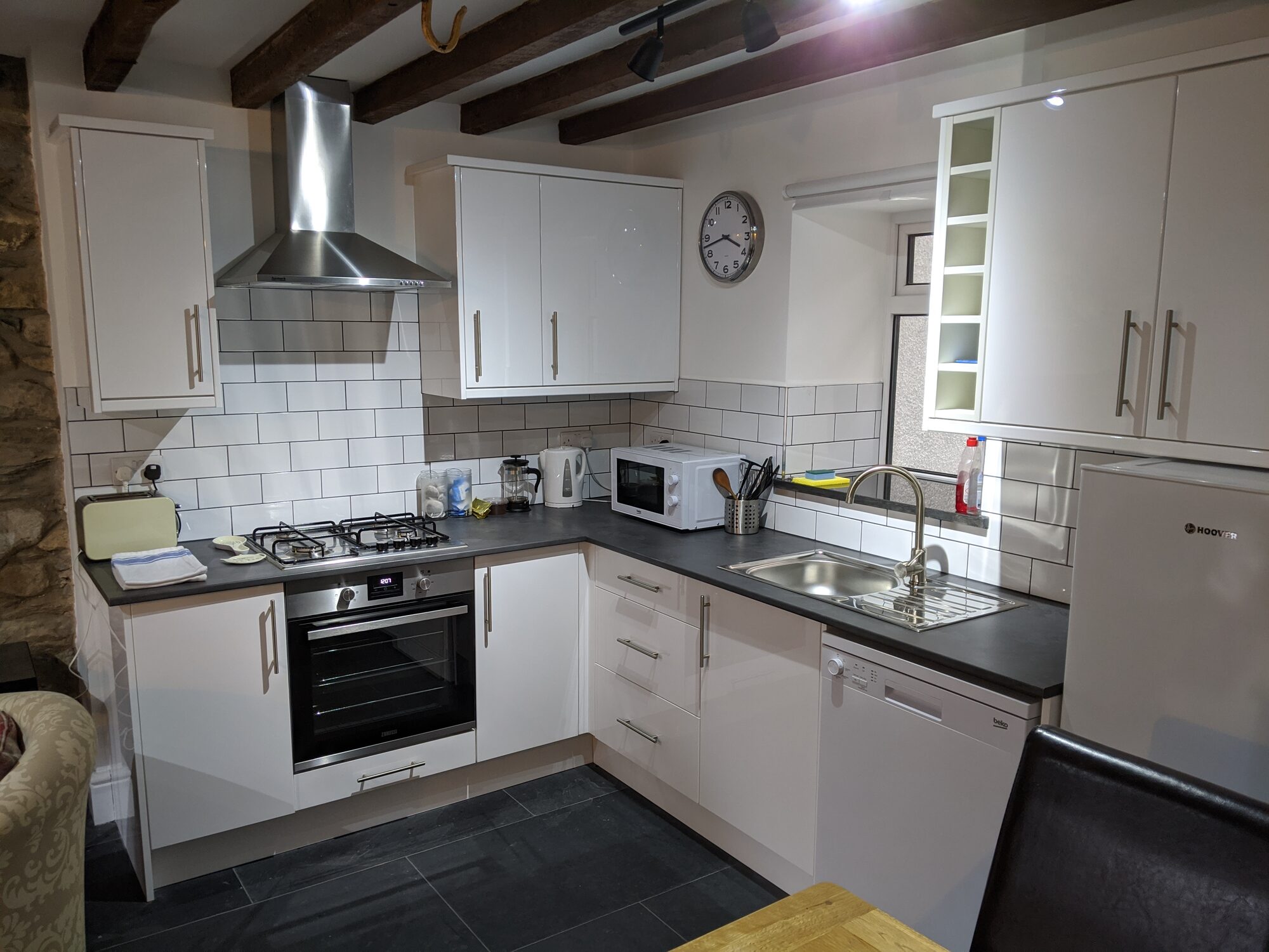 White open plan kitchen in Siabod cottage Capel Curig
