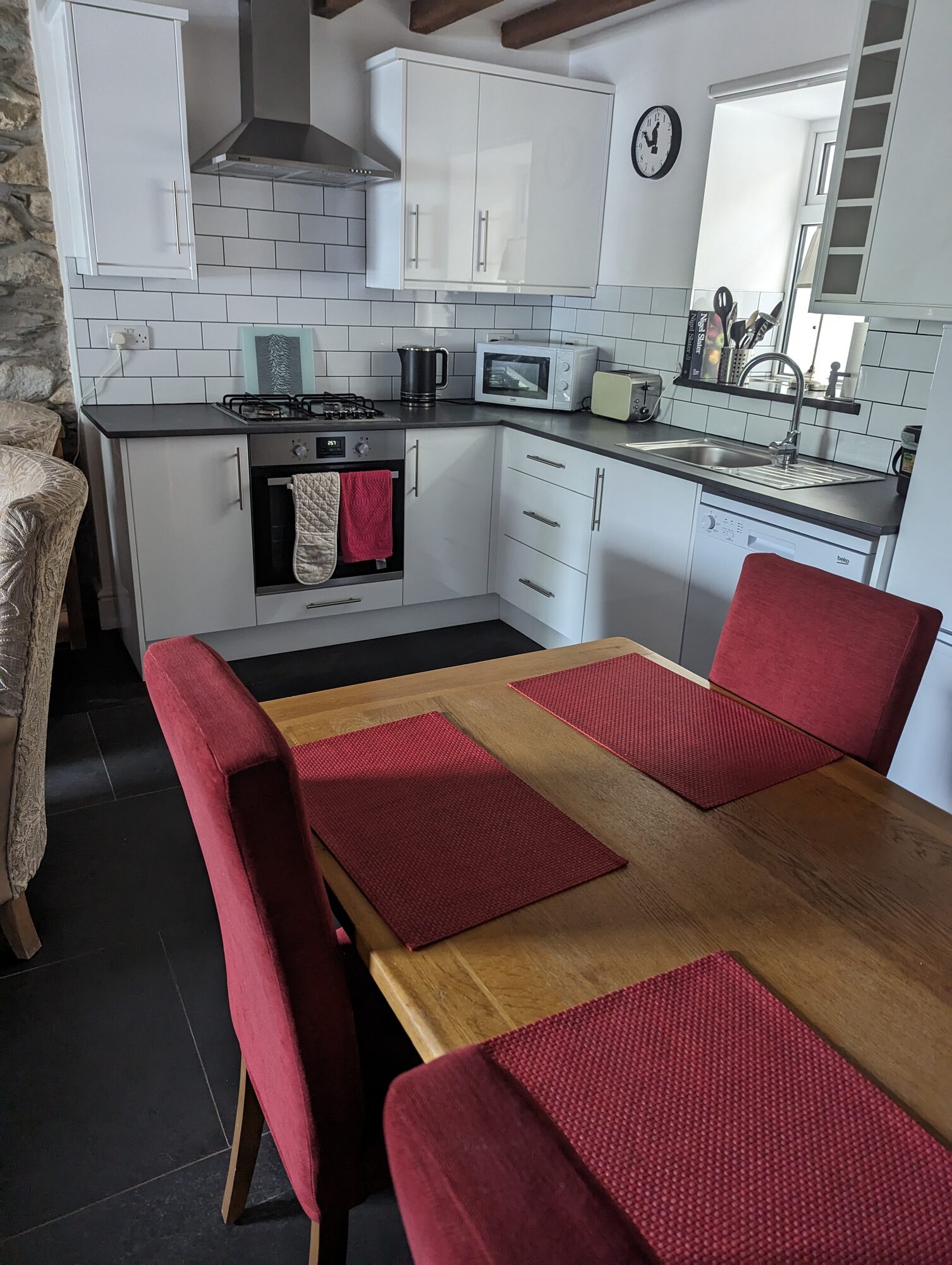 Dining table and open plan kitchen